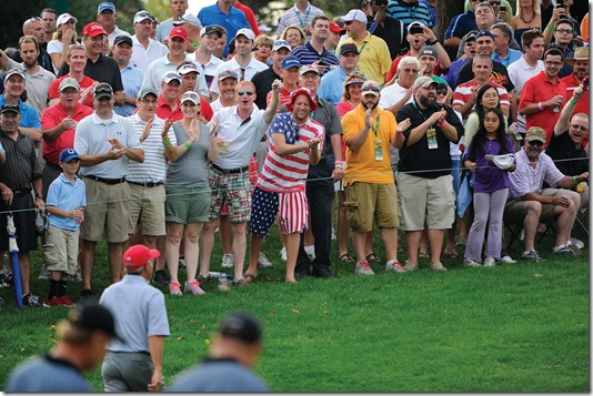 DUBLIN, OHIO - OCTOBER 04: Fans cheer as U.S. Team captain Fred Couples walks by during the Day Two Four-Ball Matches of The Presidents Cup at the Muirfield Village Golf Club on October 4, 2013 in Dublin, Ohio. (Photo by Chris Condon/PGA TOUR) 